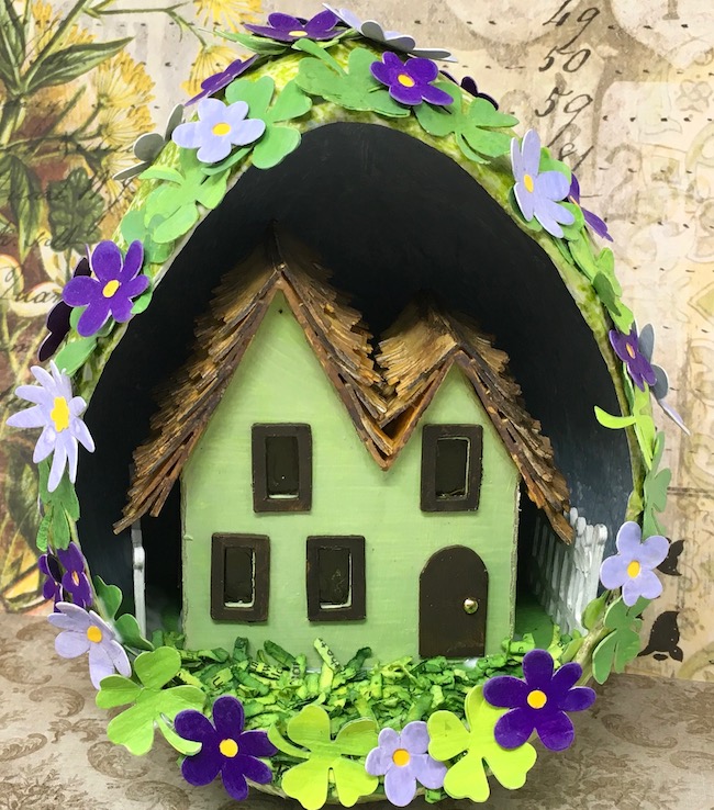 St. Patrick's Day house in paper mache egg four leaf clovers flowers