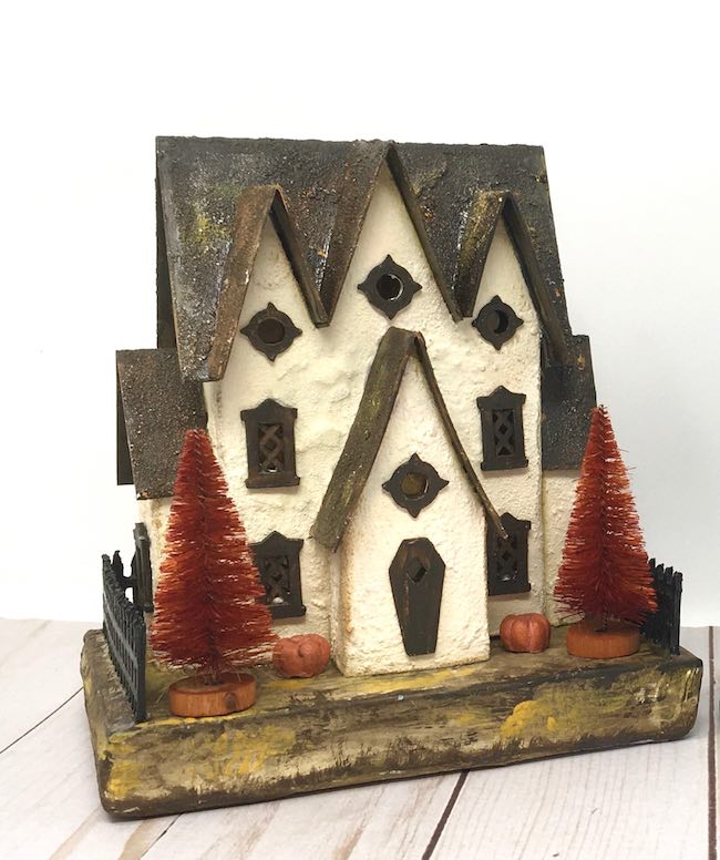 Miniature Halloween cardboard house with plaster finish