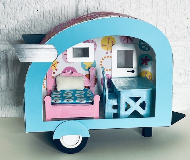 Tiny camper with miniature table chair bed
