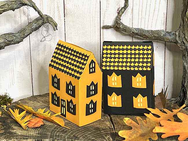 Two versions of the Haunted Cottage treat boxes black and orange