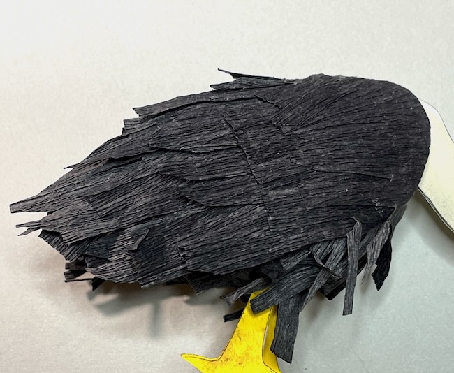 Vulture wing covered with crepe paper