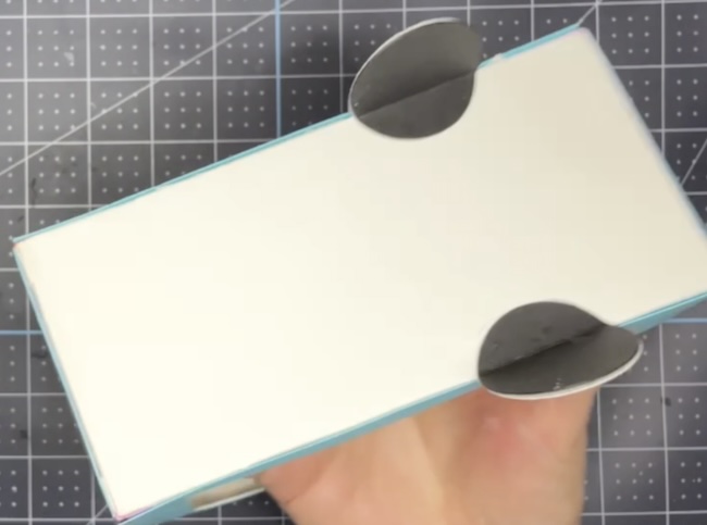 Glue wheel support piece behind wheel on camper base