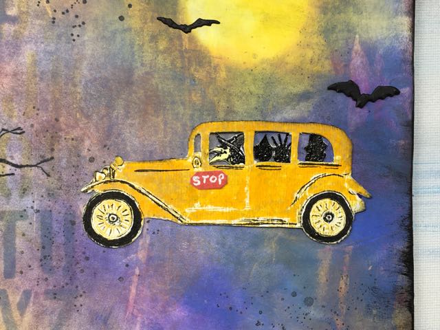 Closer view of the witch driving the little school bus with the kids in the back seat #diyhalloweendecoration #papercraft