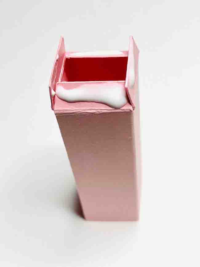 apply white PVA glue on pink cardstock mailbox post flaps