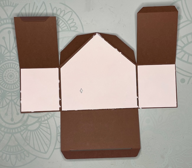 background pieces glue to front gingerbread house gift box