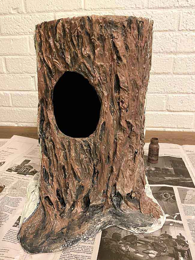 most of the paper mache tree stump painted brown