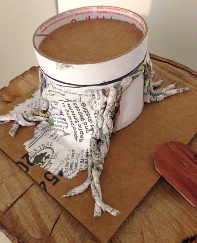 Ribbon roll base for black hat inn with paper mache roots