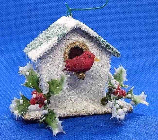Tiny white birdhouse ornament with holly